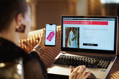 woman enjoying omnichannel shopping experience on laptop and mobile