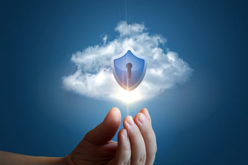 hand with cloud and security shield with keyhole